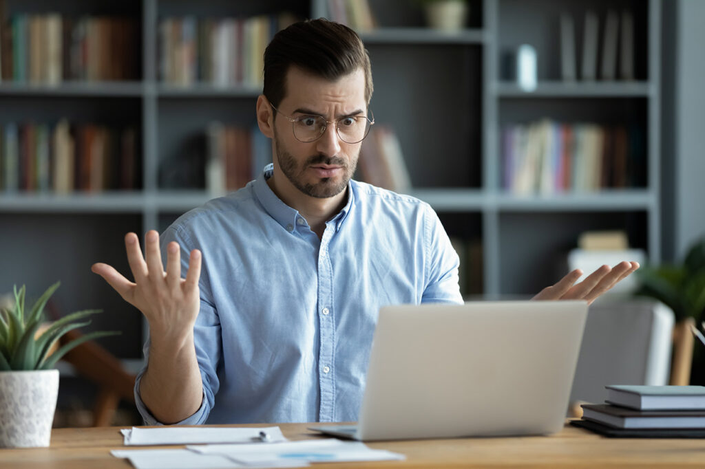 A Business Man On His Laptop Wondering if SEO is Working